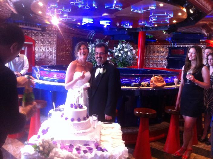 Happy couple with their cake on the CCL Freedom